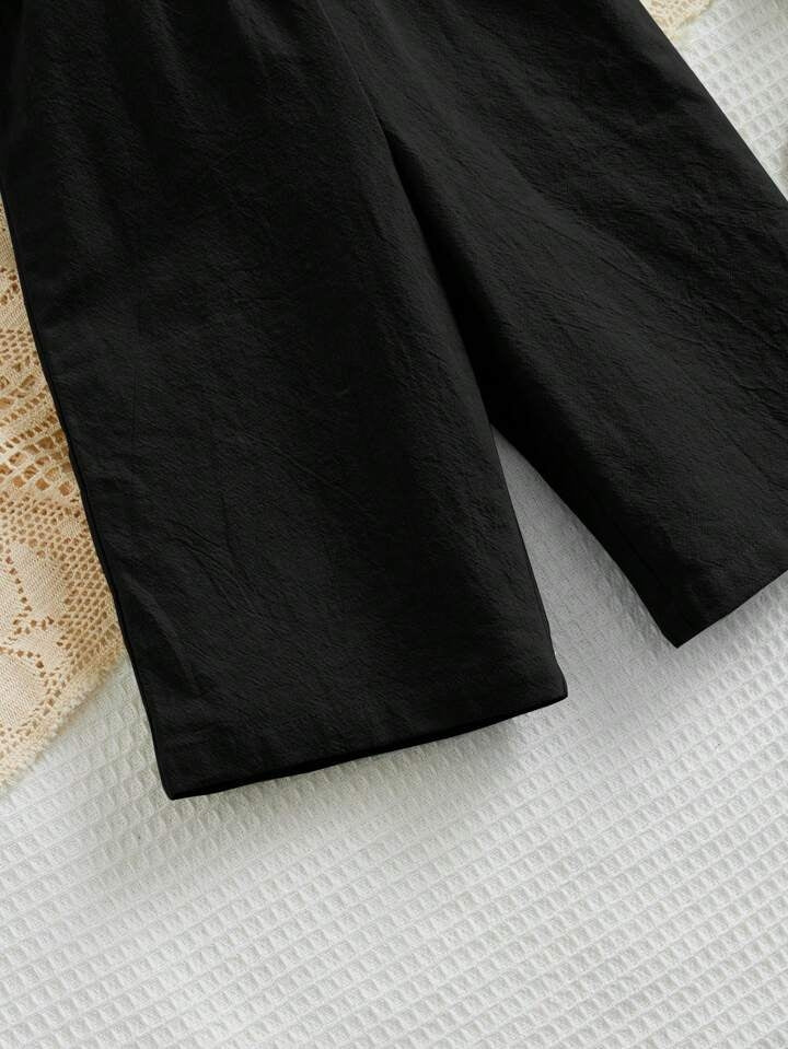 Girls Black Shirred Bodice Romper with Bow